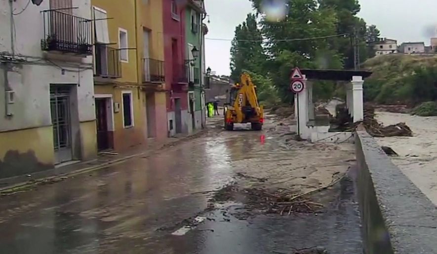 In this image made from video provided by Atlas, the flooded streets are seen in Ontiyente, Spain, Thursday, Sept. 12 2019.  A large area of southeast Spain was battered Thursday by what was forecast to be its heaviest rainfall in more than a century, with the storms wreaking widespread destruction and killing at least two people. (Atlas via AP)