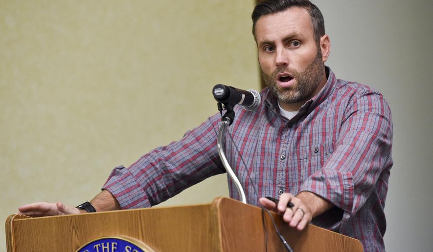 Corey Hickman of the Chrysalis Therapeutic Boarding School, comments on proposed rules pertaining to private alternative adolescent residential programs at the Department of Health and Human Services, Thursday, Sept. 12, 2019 in Helena, Mont. Operators of private adolescent residential treatment programs in Montana say they welcome state oversight, but said proposed one-size-fits-all regulations won’t meet the needs of such diverse programs. (Thom Bridge/Independent Record via AP)