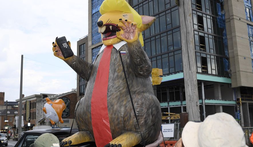 An giant inflatable rat depicting President Donald Trump is seen on the street near the U.S. House Republican Member Retreat, Thursday, Sept. 12, 2019, in Baltimore. (AP Photo/Nick Wass)