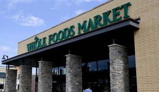 In this Aug. 8, 2018, file photo shoppers enter a Whole Foods Market in Upper Saint Clair, Pa. (AP Photo/Gene J. Puskar, File)