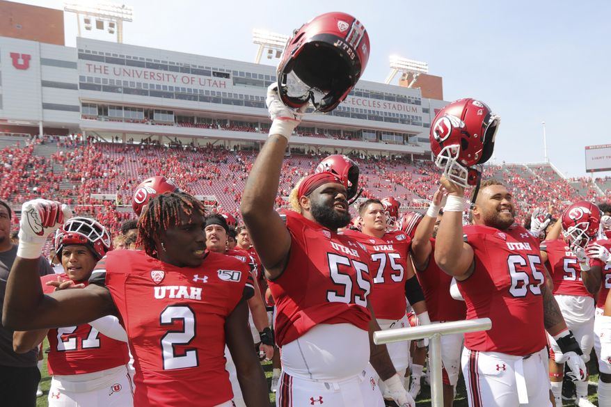Utah players celebrate their victory over Northern Illinois during an NCAA college football game Saturday, Sept. 9, 2019, Salt Lake City. (AP Photo/Rick Bowmer)