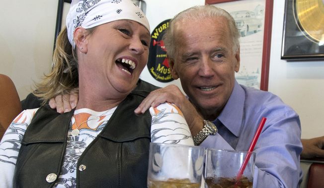 FILE - In this Sept. 9, 2012, file photo, Vice President Joe Biden visits with patrons over lunch at Cruisers Diner in Seaman, Ohio. Famous for his off-the-cuff storytelling, the former vice president regularly goes deep in the vault to pull out characters and events known only to a people of a certain age. (AP Photo/Carolyn Kaster, File)