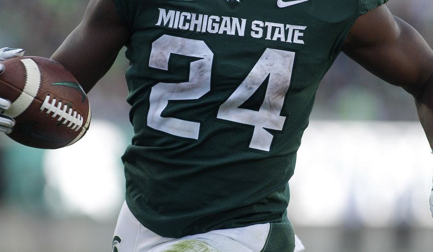 Michigan State's Elijah Collins rushes for a touchdown against Arizona State during the fourth quarter of an NCAA college football game Saturday, Sept. 14, 2019, in East Lansing, Mich. (AP Photo/Al Goldis)
