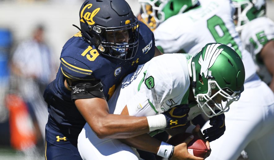 California Cameron Goode (19) sacks North Texas quarterback Mason Fine (6) during the first half of an NCAA college football game at Memorial Stadium in Berkeley, Calif., on Saturday, Sept. 14, 2019. (Jose Carlos Fajardo/San Jose Mercury News via AP)
