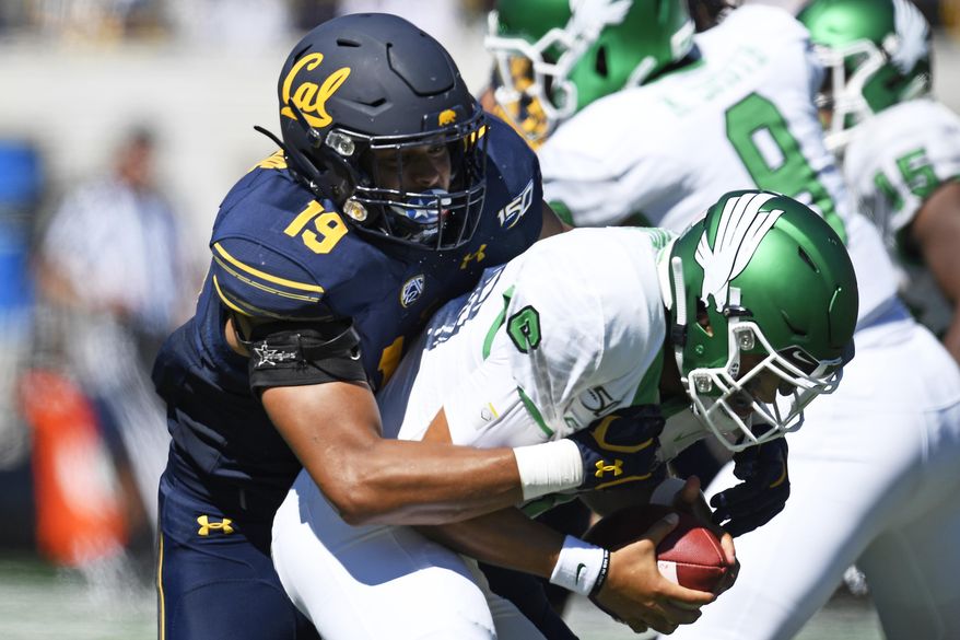 California Cameron Goode (19) sacks North Texas quarterback Mason Fine (6) during the first half of an NCAA college football game at Memorial Stadium in Berkeley, Calif., on Saturday, Sept. 14, 2019. (Jose Carlos Fajardo/San Jose Mercury News via AP)