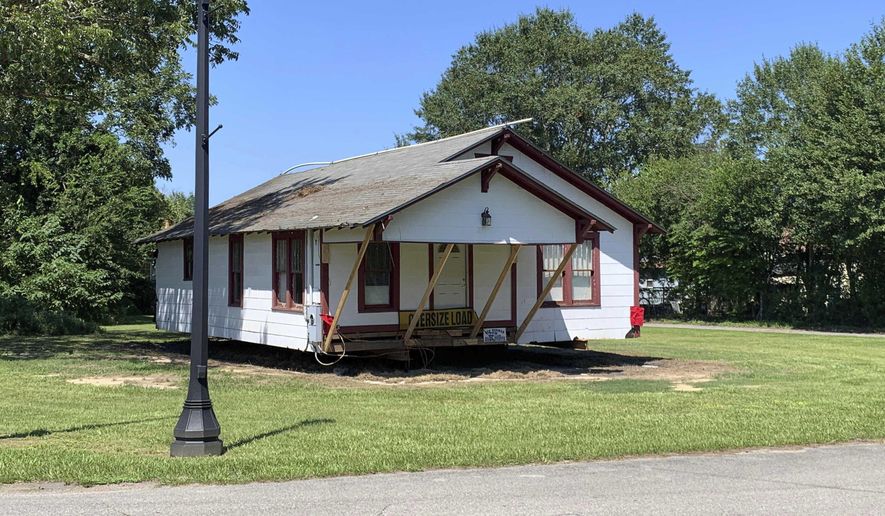 The Oseola McCarty house was relocated Friday, Aug. 30, 2019, from Miller Street to Sixth Street, where it will become a museum between the Eureka School and the African American Military History Museum. The three museums celebrate Hattiesburgs rich black history. (Lici Beveridge/Hattiesburg American via AP)
