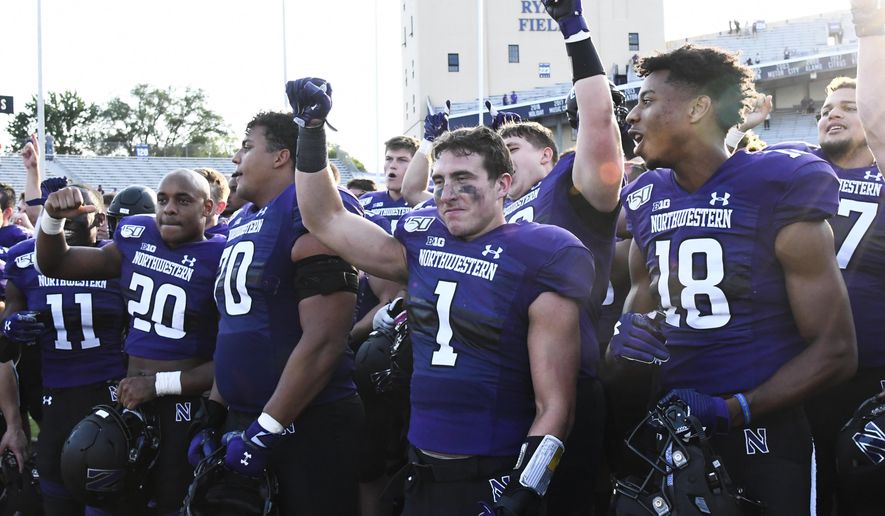 Northwestern players celebrate after an NCAA college football game against UNLV, Saturday, Sept. 14, 2019, in Evanston, Ill. Northwestern won 30-14. (AP Photo/Matt Marton)