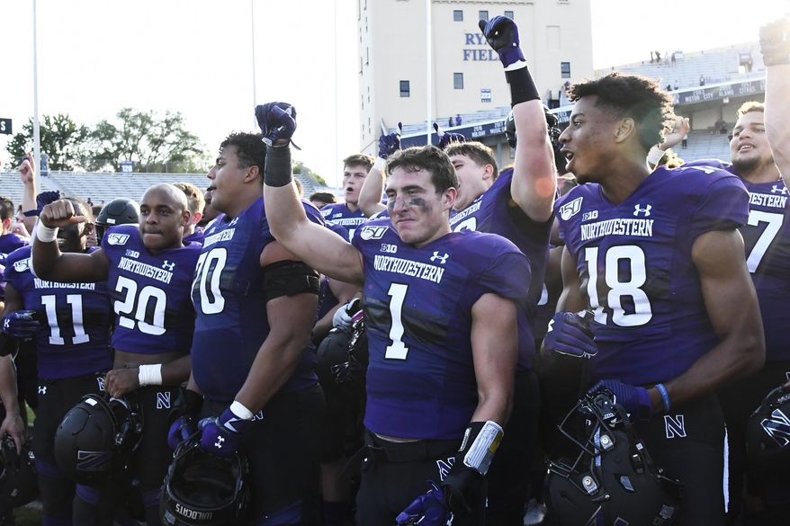 Northwestern players celebrate after an NCAA college football game against UNLV, Saturday, Sept. 14, 2019, in Evanston, Ill. Northwestern won 30-14. (AP Photo/Matt Marton)