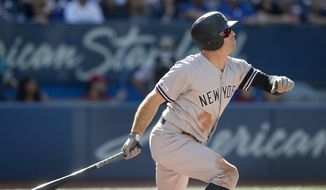 New York Yankees&#x27; Brett Gardner hits a home run against the Toronto Blue Jays in the fourth inning of a baseball game in Toronto, Saturday, Sept. 14, 2019. (Fred Thornhill/The Canadian Press via AP)