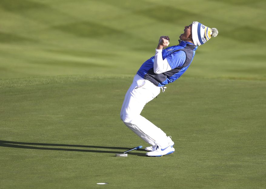 Suzann Pettersen of Europe celebrates after holing a putt on the 18th green to win the Solheim Cup against the US at Gleneagles, Auchterarder, Scotland, Sunday, Sept. 15, 2019. (AP Photo/Peter Morrison)