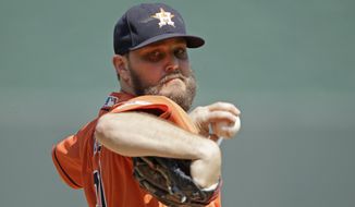 Houston Astros starting pitcher Wade Miley throws during the first inning of a baseball game against the Kansas City Royals, Sunday, Sept. 15, 2019, in Kansas City, Mo. (AP Photo/Charlie Riedel)