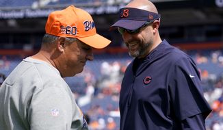 Denver Broncos head coach Vic Fangio, left, talks with Chicago Bears head coach Matt Nagy prior to an NFL football game, Sunday, Sept. 15, 2019, in Denver. (AP Photo/Jack Dempsey)