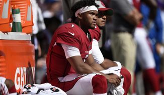 Arizona Cardinals quarterback Kyler Murray sits on the Cardinals sideline in the second half of an NFL football game against the Baltimore Ravens, Sunday, Sept. 15, 2019, in Baltimore. (AP Photo/Gail Burton)