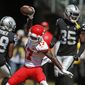 Kansas City Chiefs wide receiver Mecole Hardman (17) celebrates after scoring a touchdown during the first half of an NFL football game against the Oakland Raiders Sunday, Sept. 15, 2019, in Oakland, Calif. At left is Oakland Raiders free safety Lamarcus Joyner (29) and free safety Curtis Riley (35). (AP Photo/D. Ross Cameron)