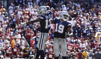 Dallas Cowboys wide receiver Amari Cooper (19) celebrates his touchdown with teammate wide receiver Michael Gallup (13) in the second half of an NFL football game, Sunday, Sept. 15, 2019, in Landover, Md. (AP Photo/Alex Brandon)