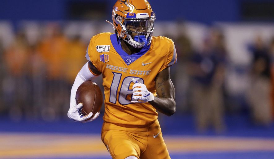 Boise State's John Hightower (16) looks upfield during a long kickoff return for touchdown during the first half of an NCAA college football game against Portland State on Saturday, Sept. 14, 2019, in Boise, Idaho. (AP Photo/Steve Conner)