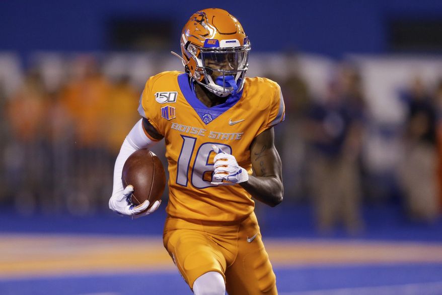Boise State's John Hightower (16) looks upfield during a long kickoff return for touchdown during the first half of an NCAA college football game against Portland State on Saturday, Sept. 14, 2019, in Boise, Idaho. (AP Photo/Steve Conner)