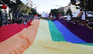 Participants wave a rainbow flag during the annual gay pride march in Belgrade, Serbia, Sunday, Sept. 15, 2019. (AP Photo/Darko Vojinovic) ** FILE **