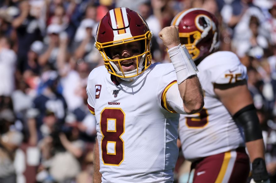 Washington Redskins quarterback Case Keenum (8) celebrates a touchdown during an NFL football game against the Dallas Cowboys, Sunday, Sept. 15, 2019, in Landover, Md. (AP Photo/Mark Tenally) ** FILE **