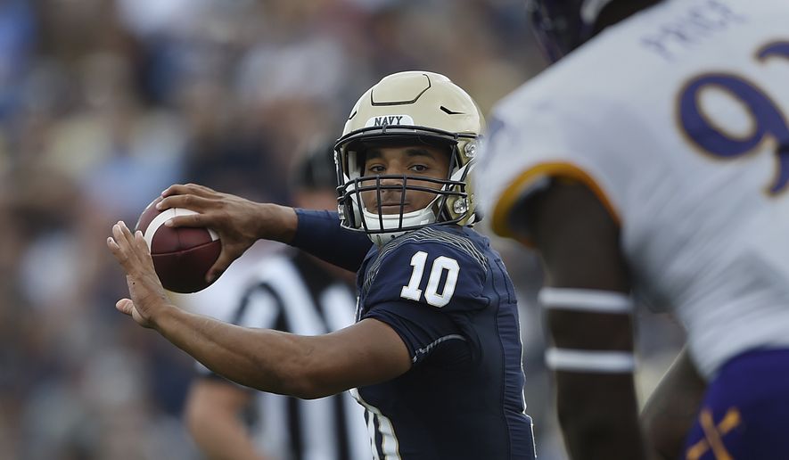 Navy quarterback Malcolm Perry throws the ball against East Carolina during an NCAA football game on Saturday, Sept. 14, 2019 in Baltimore. (AP Photo/Gail Burton)