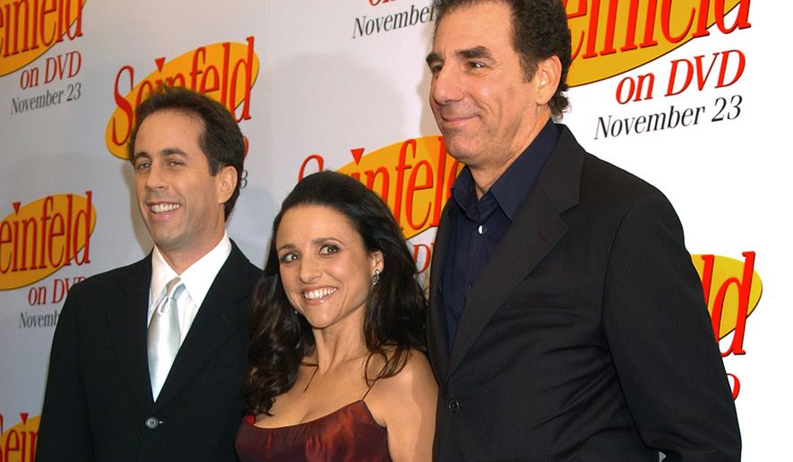 FILE - In this Nov. 17, 2004, file photo Jerry Seinfeld, left, Julia Louis Dreyfus and Michael Richards arrive to celebrate the release of the first three seasons of Seinfeld on DVD in New York. Netflix says it will start streaming all 180 episodes of the “Seinfeld” in 2021, gaining a hugely popular addition to its library as the battle for viewers heats up. (AP Photo/ Louis Lanzano, File)