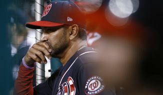 Washington Nationals manager Dave Martinez stands in the dugout during the ninth inning of the teams baseball game against the Atlanta Braves, Friday, Sept. 13, 2019, in Washington. Atlanta won 5-0. (AP Photo/Patrick Semansky)