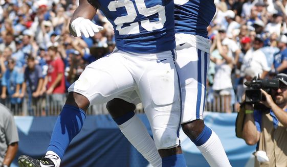 Indianapolis Colts wide receiver Parris Campbell, right, celebrates with running back Marlon Mack (25) after Campbell caught a touchdown pass against the Tennessee Titans in the first half of an NFL football game Sunday, Sept. 15, 2019, in Nashville, Tenn. (AP Photo/Wade Payne)