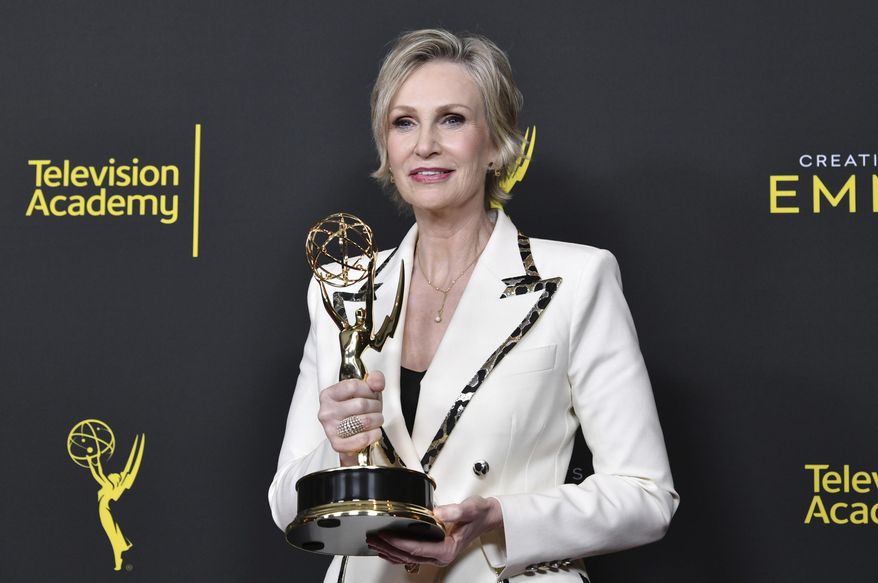 CORRECTS THE DATE TO SUNDAY, SEPT. 15 - Jane Lynch poses in the press room with the award for outstanding guest actress in a comedy series for "The Marvelous Mrs. Maisel" on night two of the Creative Arts Emmy Awards on Sunday, Sept. 15, 2019, at the Microsoft Theater in Los Angeles. (Photo by Richard Shotwell/Invision/AP)