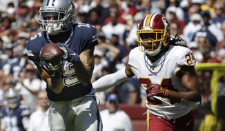 Dallas Cowboys wide receiver Devin Smith makes a catch and goes on to score against Washington Redskins cornerback Josh Norman (24) in the first half of an NFL football game, Sunday, Sept. 15, 2019, in Landover, Md. (AP Photo/Evan Vucci)