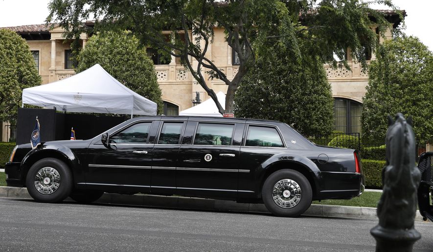 FILE - In this April 5, 2019, file photo, the presidential limousine of President Donald Trump is parked on a hill in front of a private residence in Beverly Hills, Calif., as he meets with supporters during a fundraiser. Trump is set to raise more than $15 million this week during a two-day California fundraising swing. (AP Photo/Jacquelyn Martin, File)