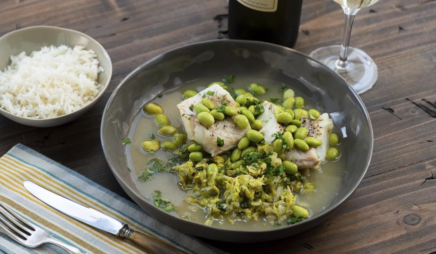 This 2018 photo provided by Katie Workman shows a dish of cod, cabbage and edamame taken in New York. Cabbage, that taken-for-granted vegetable, that sturdy, dense staple of many a poor, ancestral homeland, is finally getting respect. (Cheyenne Cohen/Katie Workman via AP)