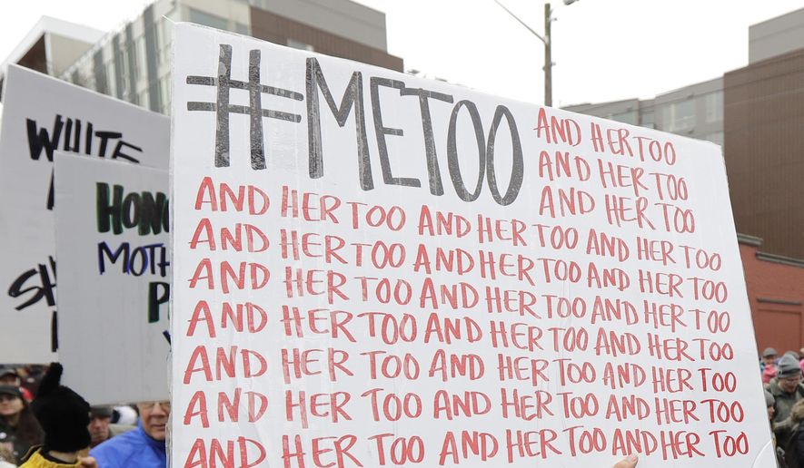 In this Jan. 20, 2018, file photo, a marcher carries a sign with the popular Twitter hashtag #MeToo used by people speaking out against sexual harassment as she takes part in a Women's March in Seattle. According to a study published Monday, Sept. 16, 2019, the first sexual experience for many U.S. women was forced or coerced intercourse in their early teens, encounters that for some may have had lasting health repercussions. (AP Photo/Ted S. Warren, File)