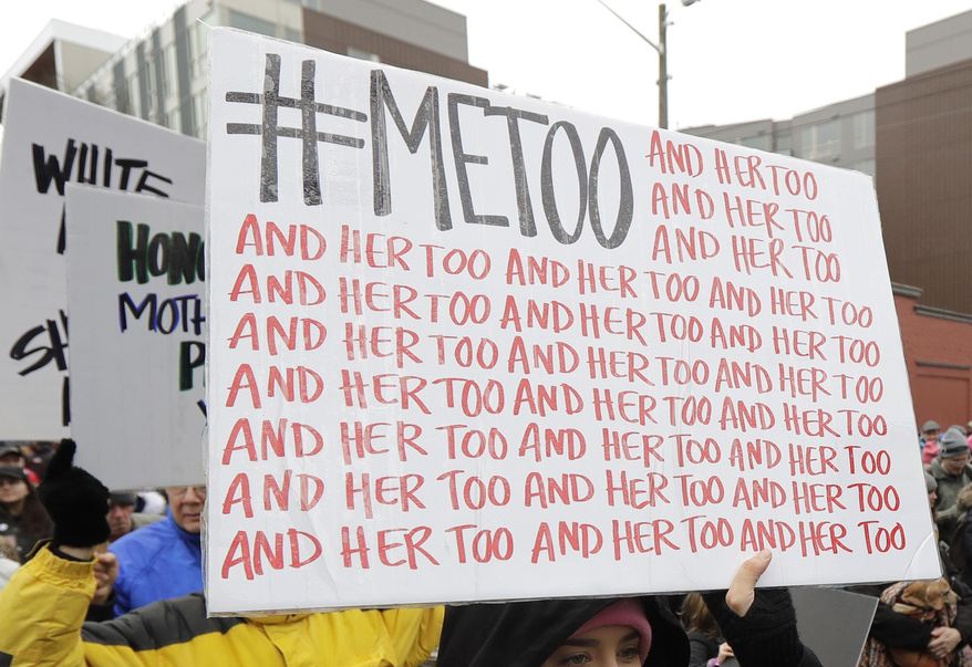 In this Jan. 20, 2018, file photo, a marcher carries a sign with the popular Twitter hashtag #MeToo used by people speaking out against sexual harassment as she takes part in a Women's March in Seattle. According to a study published Monday, Sept. 16, 2019, the first sexual experience for many U.S. women was forced or coerced intercourse in their early teens, encounters that for some may have had lasting health repercussions. (AP Photo/Ted S. Warren, File)