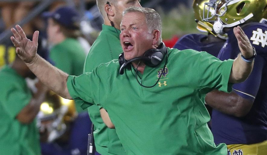 FILE - In this Sept. 1, 2018, file photo, Notre Dame head coach Brian Kelly argues a call in the second half of an NCAA football game against Michigan, in South Bend, Ind. Notre Dame and Georgia. Two of college football's most storied programs meet for the first time in one of its most famed settings, a game that already feels special because of its historic ramifications but is also likely to have a huge impact on this year's race to the College Football Playoff. (AP Photo/Paul Sancya, File)