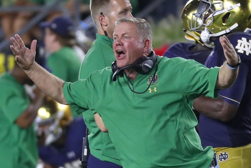 FILE - In this Sept. 1, 2018, file photo, Notre Dame head coach Brian Kelly argues a call in the second half of an NCAA football game against Michigan, in South Bend, Ind. Notre Dame and Georgia. Two of college football's most storied programs meet for the first time in one of its most famed settings, a game that already feels special because of its historic ramifications but is also likely to have a huge impact on this year's race to the College Football Playoff. (AP Photo/Paul Sancya, File)