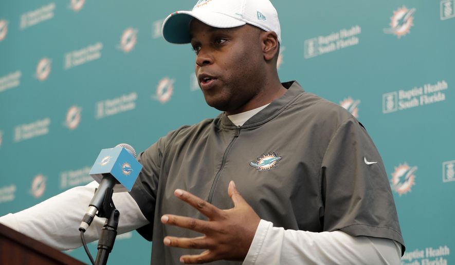 FILE - In this April 17, 2019, file photo, Miami Dolphins general manager Chris Grier speaks during a news conference during voluntary minicamp at the Miami Dolphins NFL football training facility, in Davie, Fla. Grier says this year&#39;s roster dismantling has been more drastic than he expected, but a turnaround can come quickly because the team will be aggressive in free agency in 2020. (AP Photo/Lynne Sladky, File)