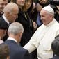 In this April 29, 2016, file photo, then-Vice President Joe Biden shakes hands with Pope Francis at the Vatican. (AP Photo/Andrew Medichini, File)