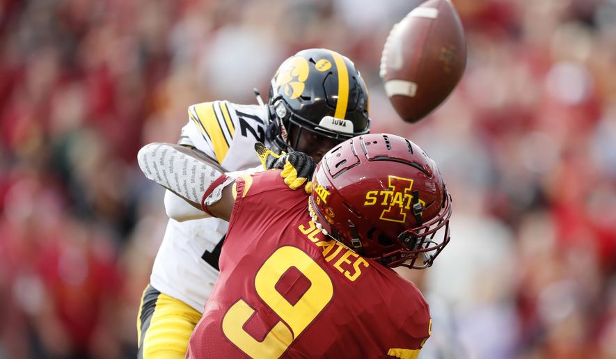 Iowa defensive back D.J. Johnson breaks up a pass intended for Iowa State wide receiver Joseph Scates (9) during the first half of an NCAA college football game, Saturday, Sept. 14, 2019, in Ames, Iowa. (AP Photo/Charlie Neibergall)