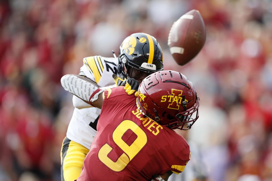 Iowa defensive back D.J. Johnson breaks up a pass intended for Iowa State wide receiver Joseph Scates (9) during the first half of an NCAA college football game, Saturday, Sept. 14, 2019, in Ames, Iowa. (AP Photo/Charlie Neibergall)