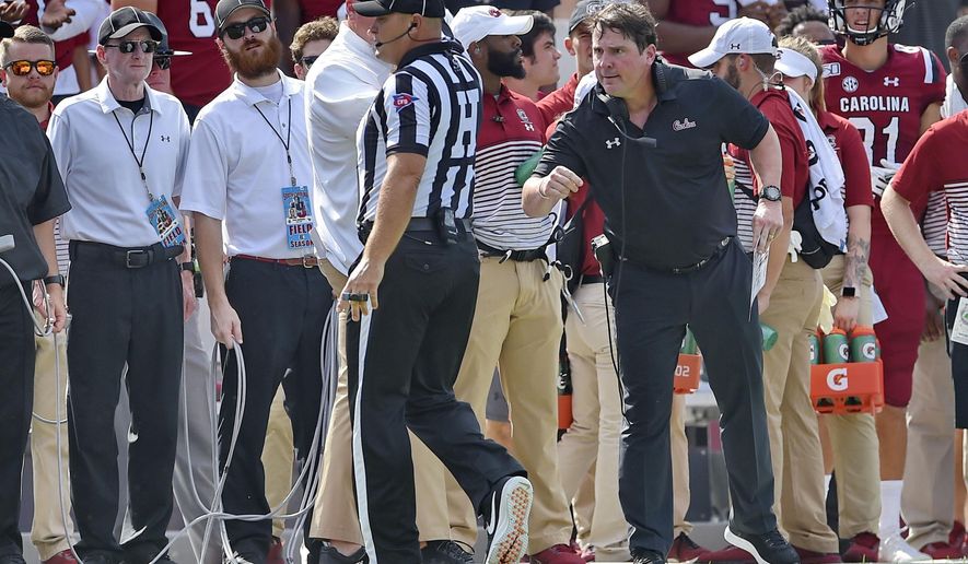 South Carolina head coach Will Muschamp has a word with an official during the first half of an NCAA college football game against Alabama Saturday, Sept. 14, 2019, in Columbia, S.C. (AP Photo/Richard Shiro)