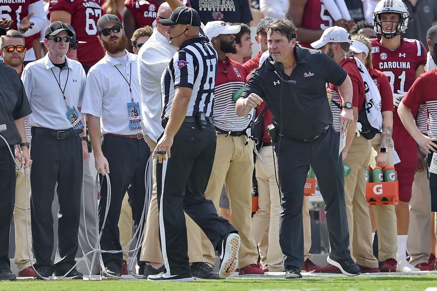 South Carolina head coach Will Muschamp has a word with an official during the first half of an NCAA college football game against Alabama Saturday, Sept. 14, 2019, in Columbia, S.C. (AP Photo/Richard Shiro)