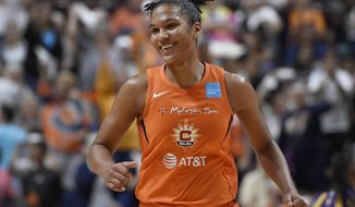 Connecticut Sun&#39;s Alyssa Thomas smiles after a basket during the second half of a WNBA basketball playoff game against the Los Angeles Sparks, Tuesday, Sept. 17, 2019, in Uncasville, Conn. (AP Photo/Jessica Hill)