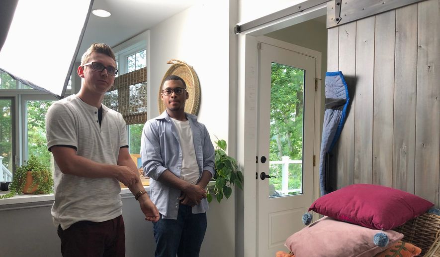 Tyler Berryman (left) and Isaiah Dixon, standing in a home in Arnold, Maryland, on June 16, 2019, are featured in a video series called "Understand AD Squad," a national campaign to raise awareness about atopic dermatitis, a form of eczema. (Shen Wu Tan / The Washington Times)