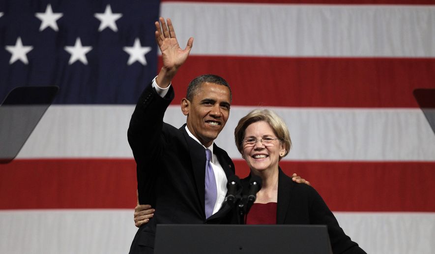 President Barack Obama waves to supporters as he hugs then-Massachusetts senatorial candidate Elizabeth Warren before addressing supporters during a campaign fundraiser at Symphony Hall in Boston, Monday, June 25, 2012. (AP Photo/Stephan Savoia) ** FILE **