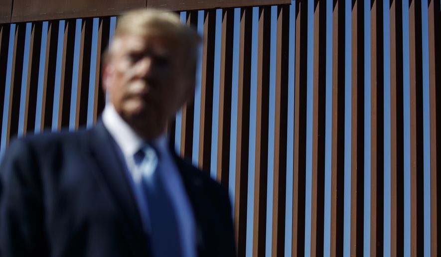 President Donald Trump tours a section of the southern border wall, Wednesday, Sept. 18, 2019, in Otay Mesa, Calif. (AP Photo/Evan Vucci) **FILE**