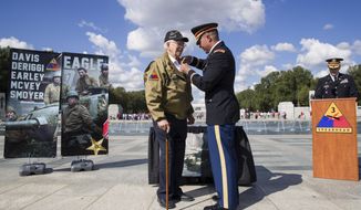 World War II veteran Clarence Smoyer, 96, receives the Bronze Star from U.S. Army Maj. Peter Semanoff at the World War II Memorial, Wednesday, Sept. 18, 2019, in Washington. Smoyer fought with the U.S. Army&#39;s 3rd Armored Division, nicknamed the Spearhead Division. In 1945, he defeated a German Panther tank near the cathedral in Cologne, Germany — a dramatic duel filmed by an Army cameraman that was seen all over the world. (AP Photo/Alex Brandon)
