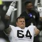 FILE - In this July 29, 2019, file photo, Oakland Raiders center Richie Incognito stretches during NFL football training camp in Napa, Calif. Guard Richie Incognito returns to the Raiders after missing two games for a suspension for violating the NFL&#x27;s personal conduct policy. (AP Photo/Eric Risberg, File)