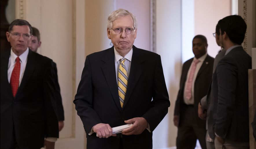 Senate Majority Leader Mitch McConnell, R-Ky., joined at left by Sen. John Barrasso, R-Wyo., arrives to speak to reporters during a news conference at the Capitol in Washington, Tuesday, Sept. 17, 2019. (AP Photo/J. Scott Applewhite)
