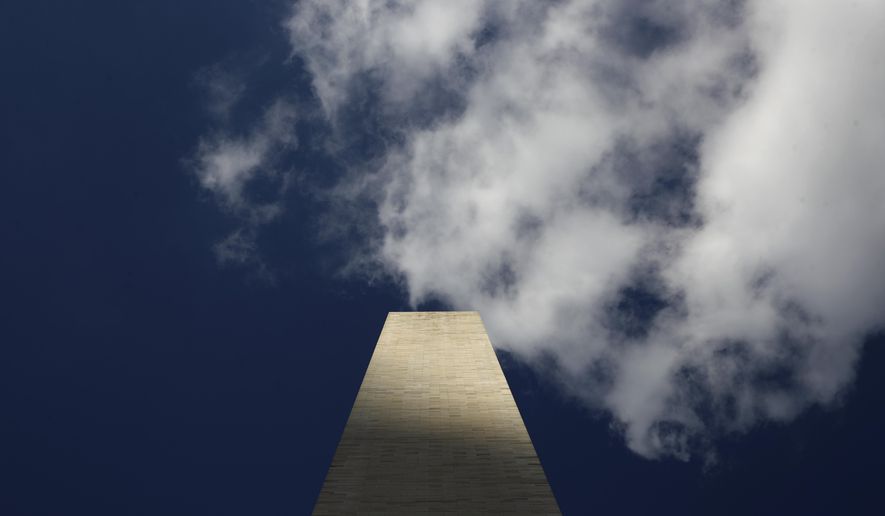 Clouds roll over the Washington Monument, as seen from the foot of the monument, during a press preview tour ahead of its official reopening, Wednesday, Sept. 18, 2019, in Washington. The monument, which has been closed to the public since August 2016, is scheduled to re-open Thursday, Sept. 19. (AP Photo/Patrick Semansky)