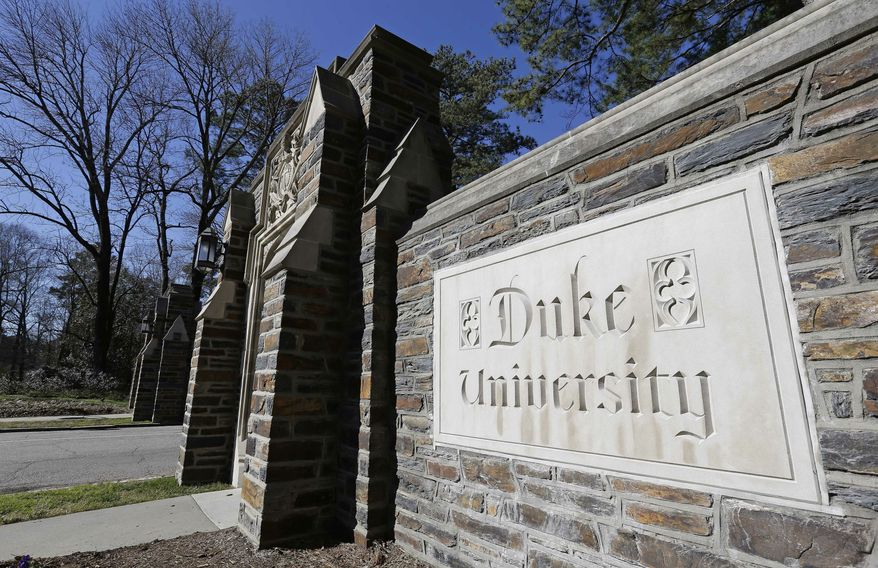This Jan. 28, 2019 file photo shows the entrance to the main Duke University campus in Durham, N.C.   (AP Photo/Gerry Broome, File) **FILE**
